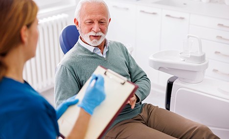 a dentist consulting with a patient