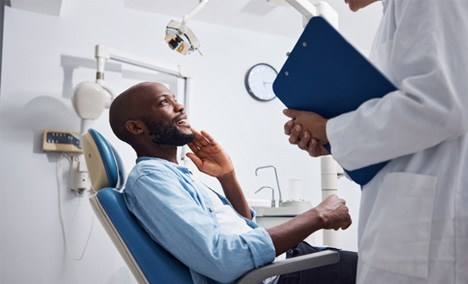 a patient speaking with a dentist