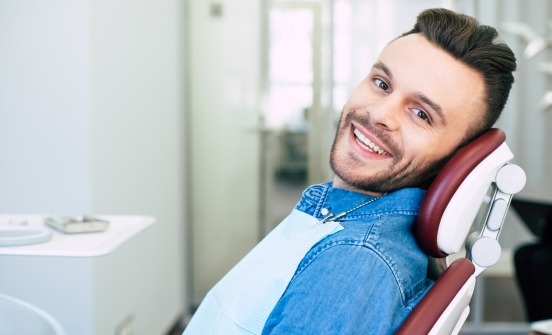 Smiling man in dental chair