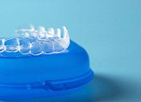 Closeup of Invisalign tray on storage case