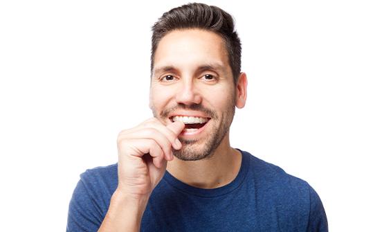 Man placing clear aligner