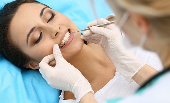 Woman receiving periodontal therapy