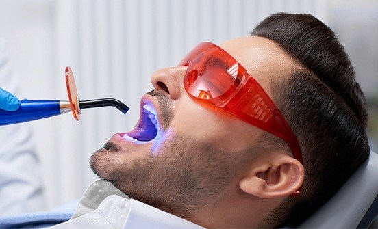 Man receiving dental sealants
