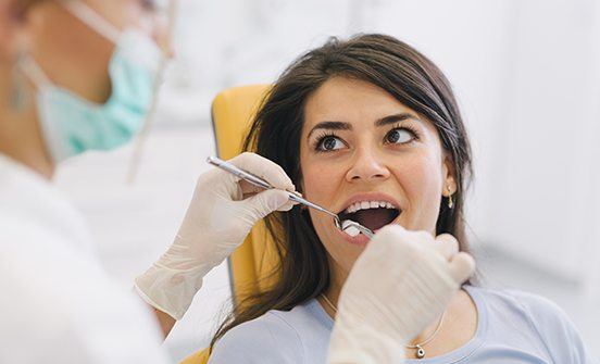 Woman receiving a root canal
