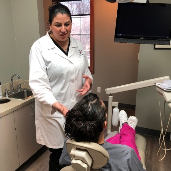 Dr. Rabban talking to dental patient