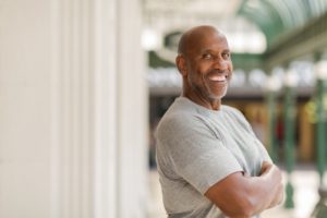 Smiling, confident man with dental implants