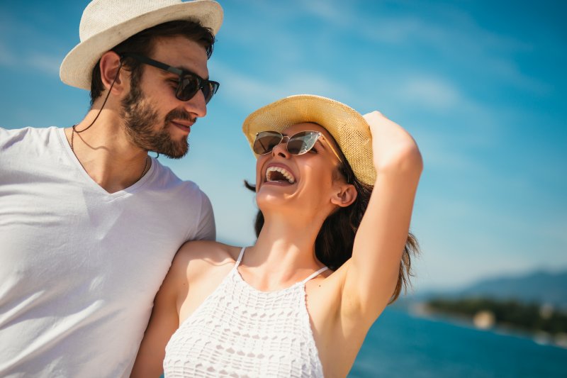 Couple smiling while on summer vacation