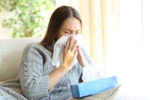 woman at home with tissues 