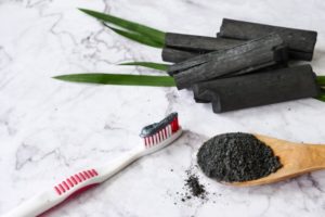 charcoal toothpaste on a toothbrush