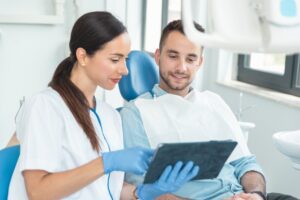 a dentist consulting with a patient