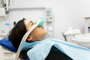 a woman receiving nitrous oxide in a dental office